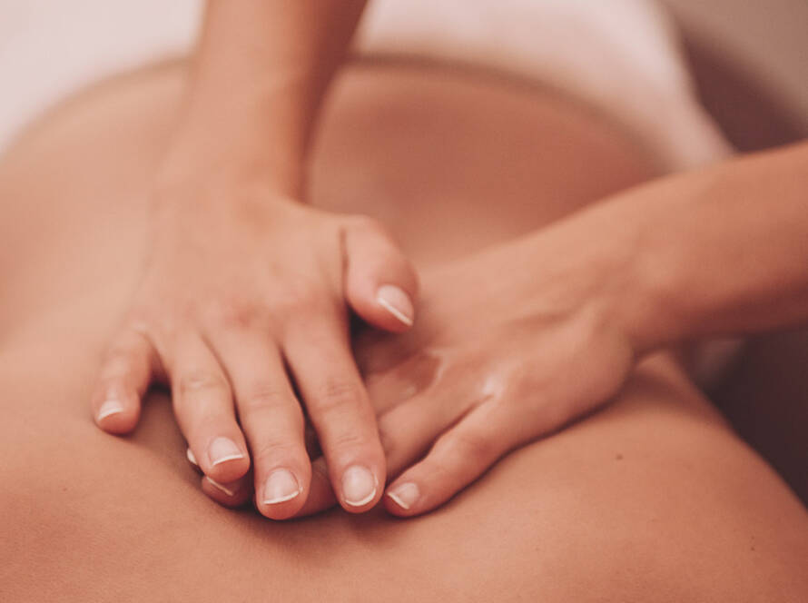 Client relaxing in a peaceful spa environment during Swedish massage