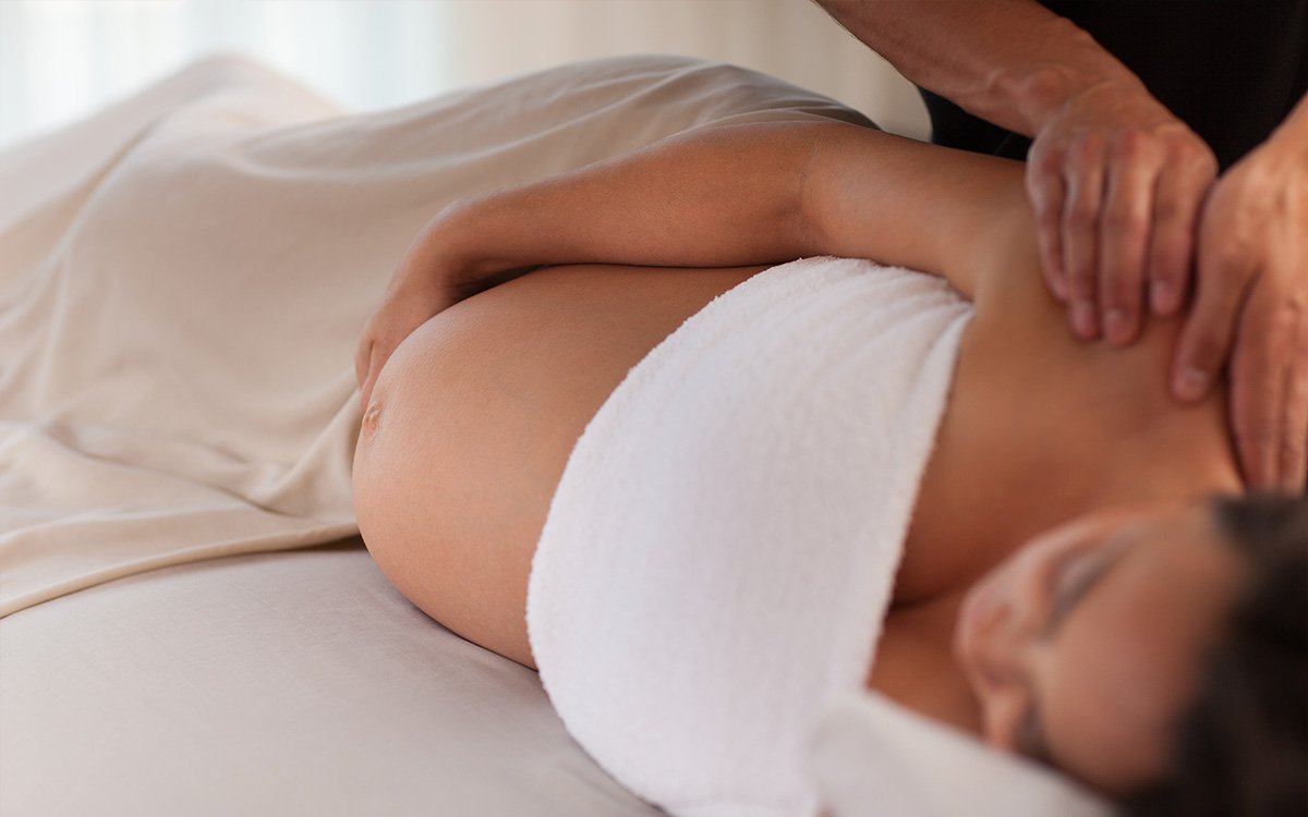 Pregnancy massage focusing on gentle techniques for the back and body