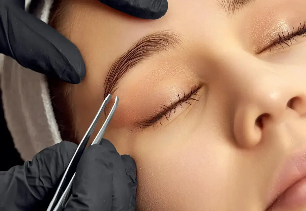 Professional brow shaping with tweezing at Rowan & Peridot Collective in Lethbridge