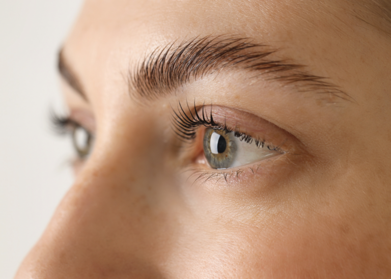 Natural lashes after a lash lamination, lifted and curled for a soft, enhanced look.