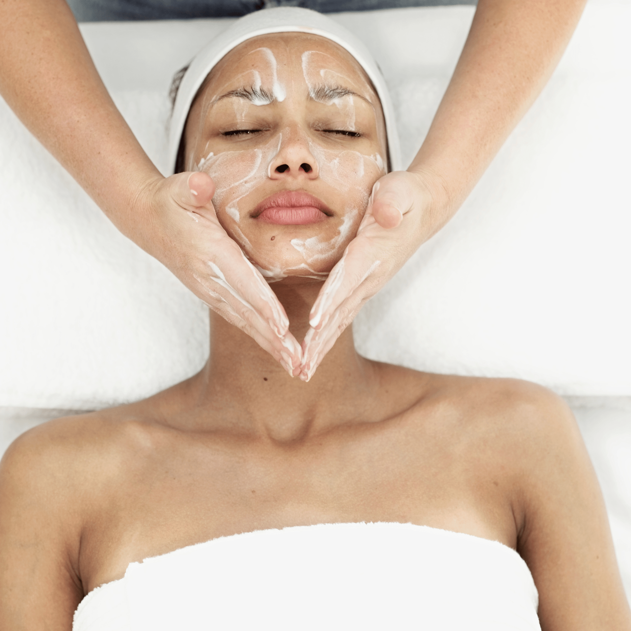 Skincare products being applied during a professional facial treatment