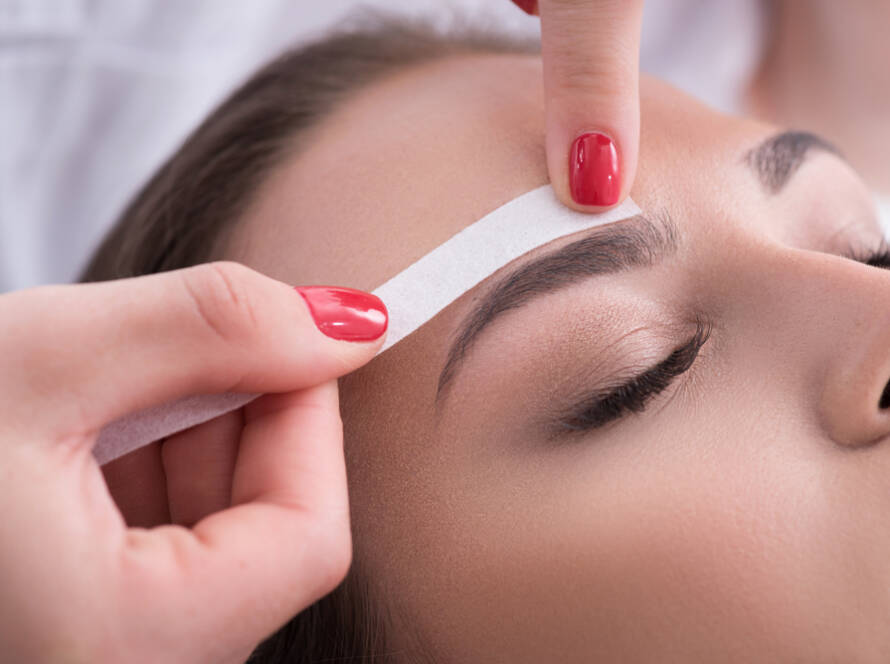 Eyebrow waxing treatment at Rowan & Peridot Collective, shaping and defining brows naturally