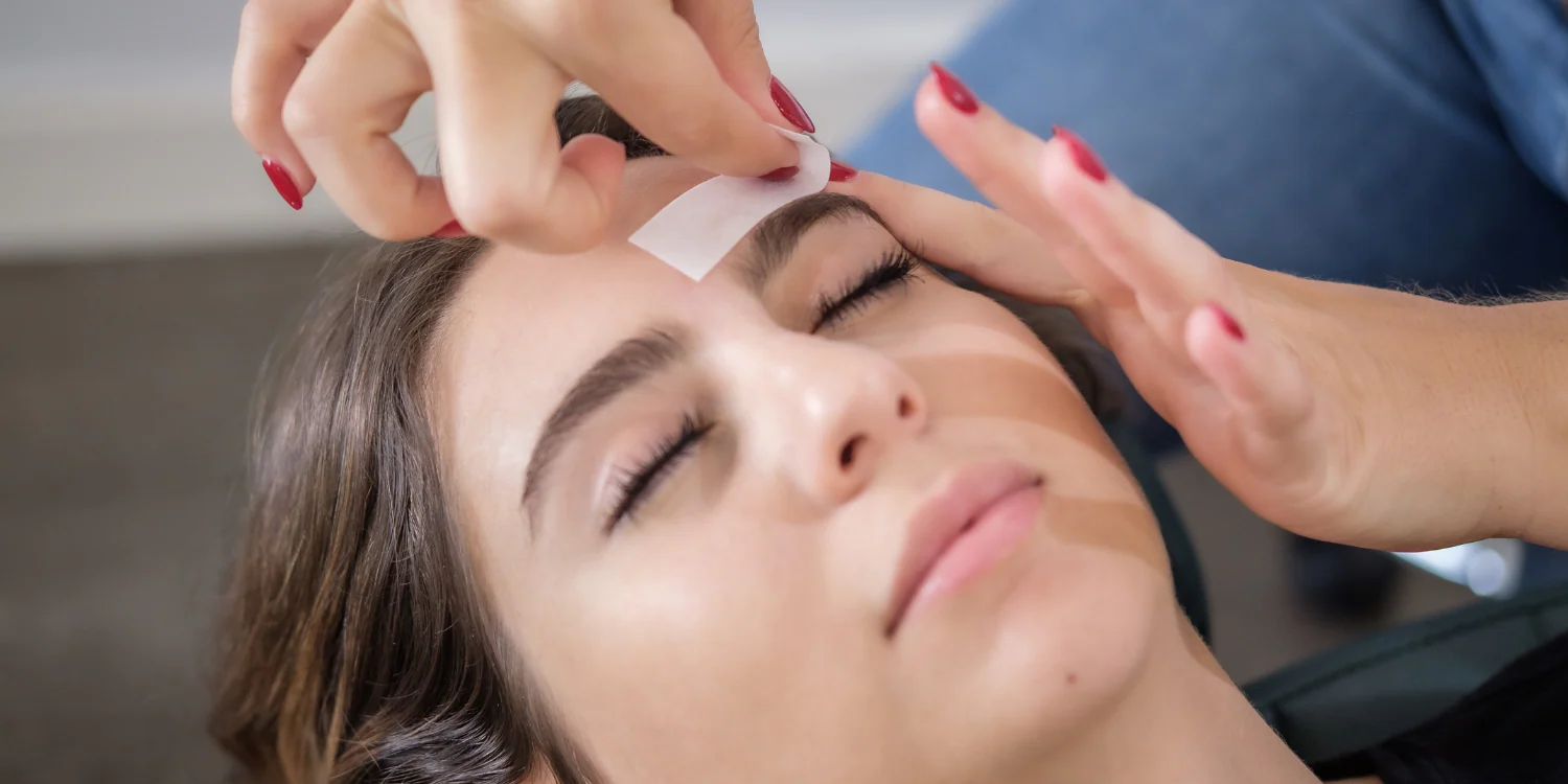 Close-up of professional facial waxing being performed on a client