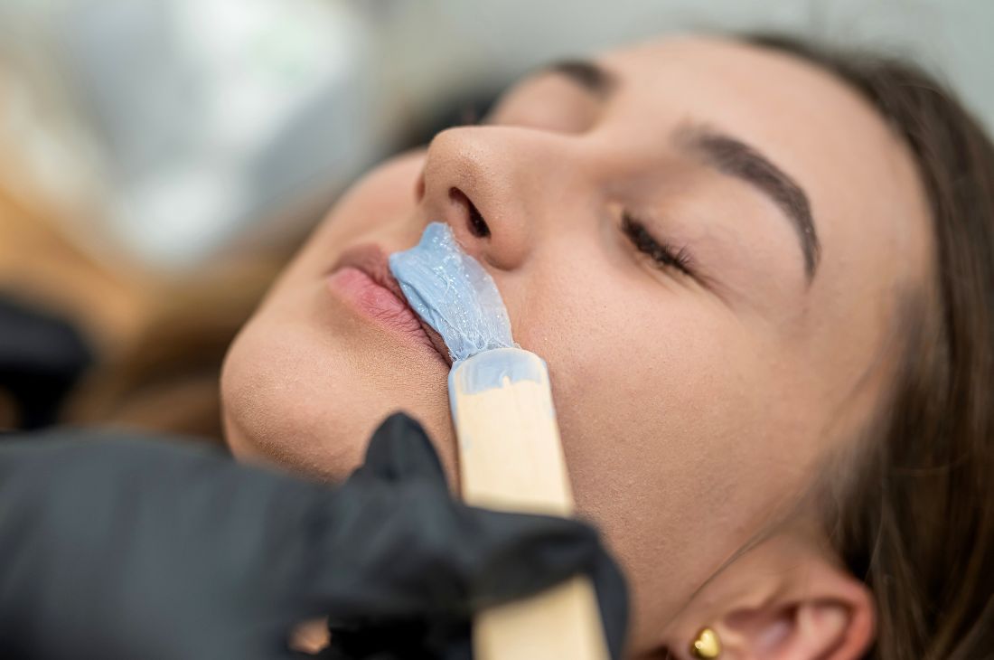 Chin waxing treatment performed by a professional esthetician