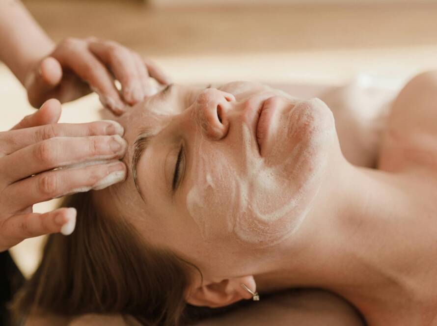 Client relaxing during a Deluxe Facial treatment