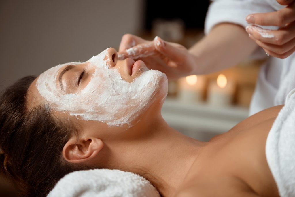 Applying probiotic skincare products during Lunchtime Facial