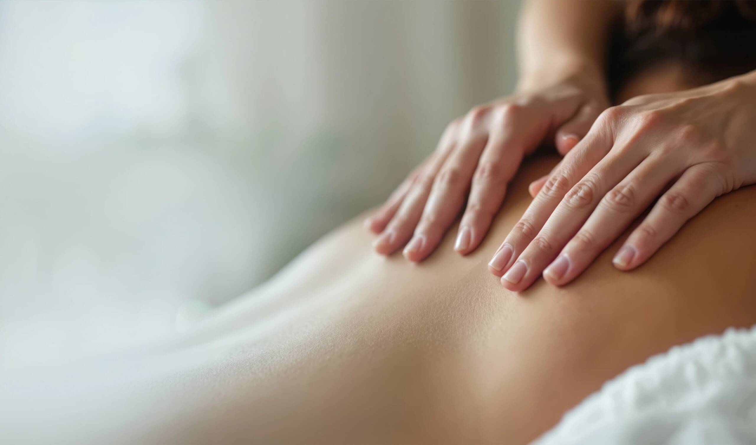 massage therapist consulting with client before treatment in Lethbridge