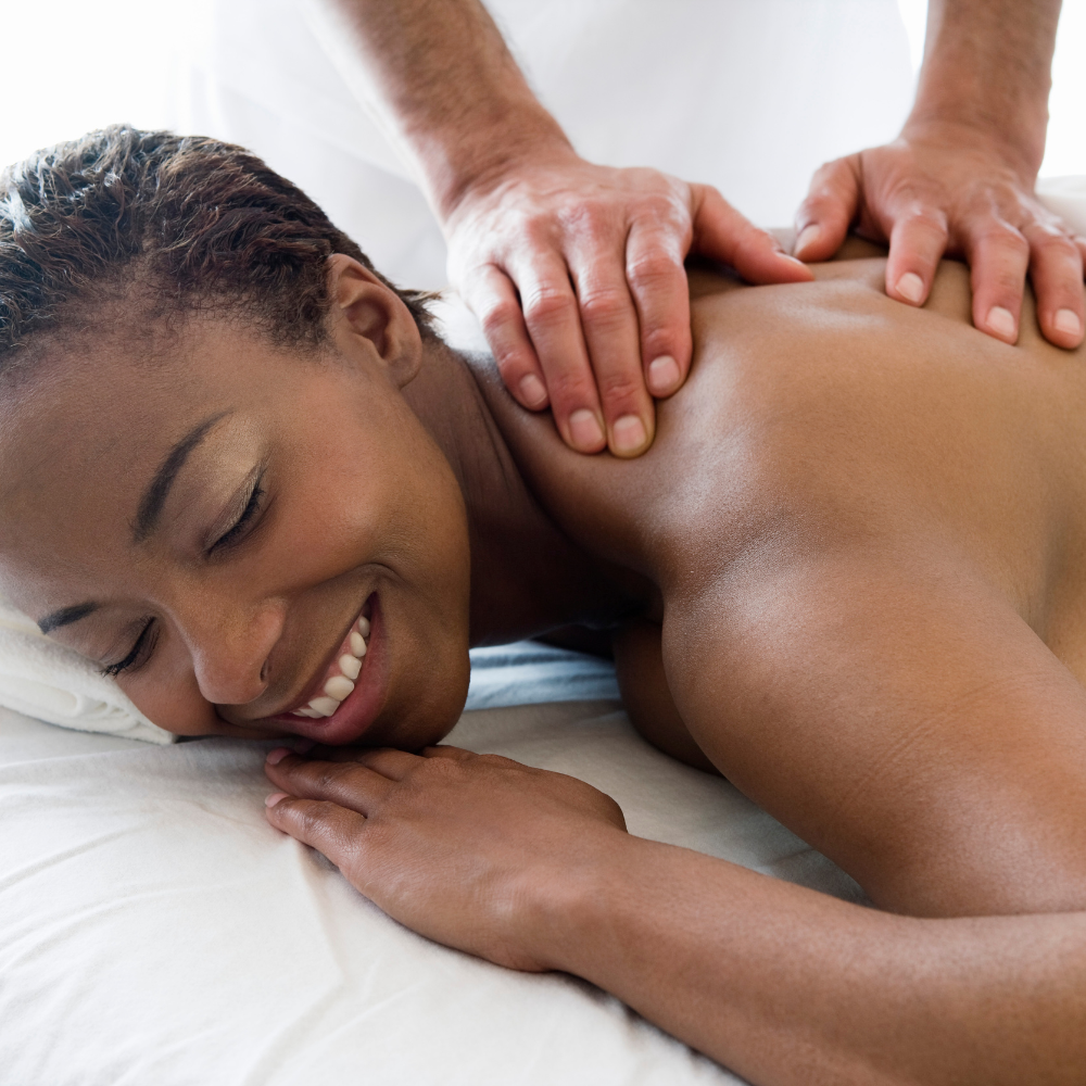 Client relaxing during a full-body spa massage session in Lethbridge