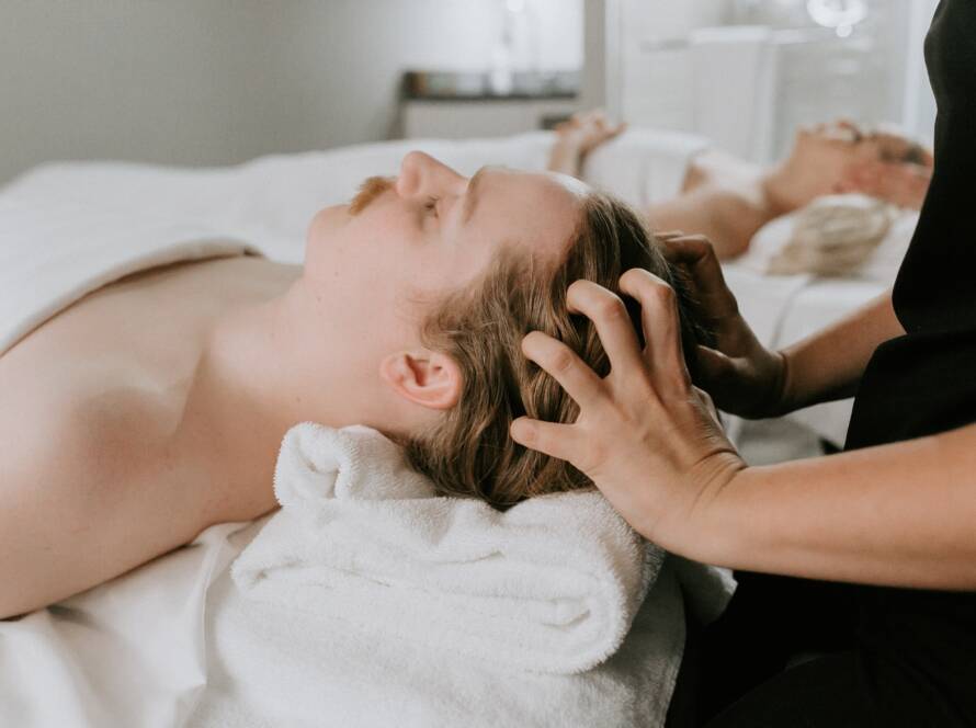 Therapist using smooth massage techniques during a spa massage treatment