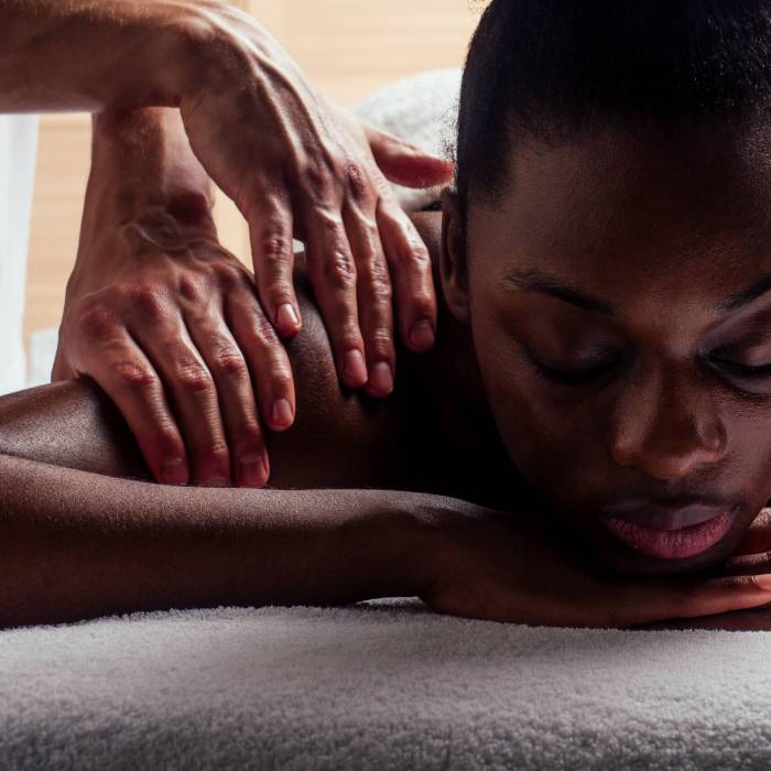 Deep tissue massage treatment targeting muscle tension in the upper back and shoulders